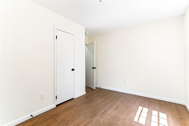 unfurnished room featuring hardwood / wood-style floors