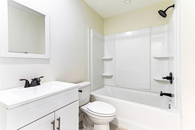 full bathroom with shower / tub combination, vanity, and toilet