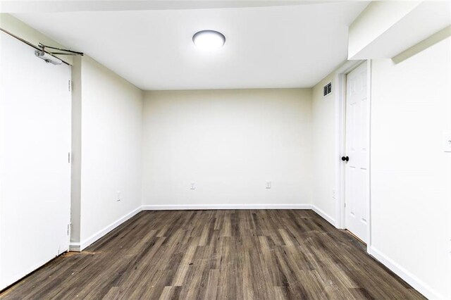 basement with dark wood-type flooring