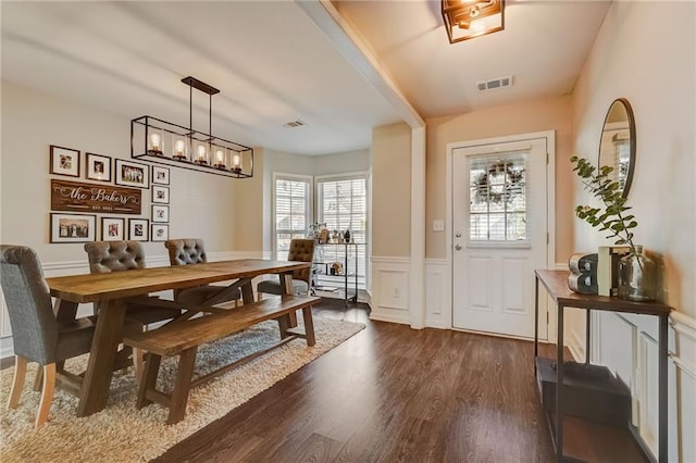 dining room with dark hardwood / wood-style flooring