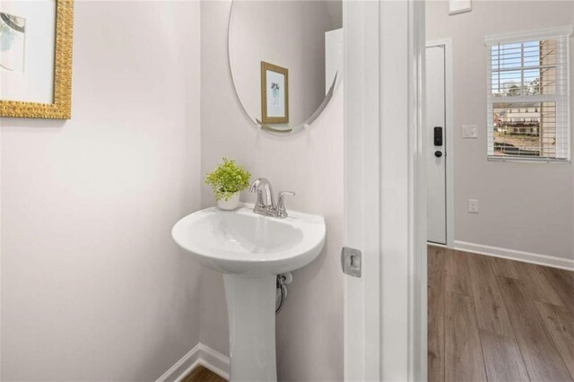1346 Riverstone Rd Unit 107, Jonesboro, GA 30238 - bathroom with wood finished floors and baseboards