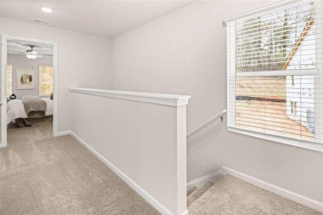 1346 Riverstone Rd Unit 107, Jonesboro, GA 30238 - hallway featuring visible vents, baseboards, an upstairs landing, recessed lighting, and carpet flooring