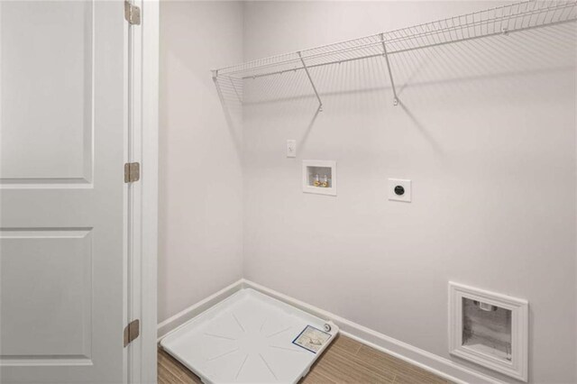 1346 Riverstone Rd Unit 107, Jonesboro, GA 30238 - clothes washing area with hookup for an electric dryer, washer hookup, and baseboards