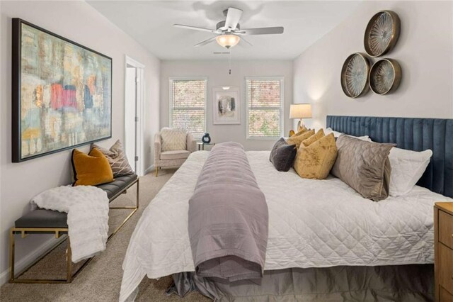 1346 Riverstone Rd Unit 107, Jonesboro, GA 30238 - carpeted bedroom with ceiling fan and baseboards