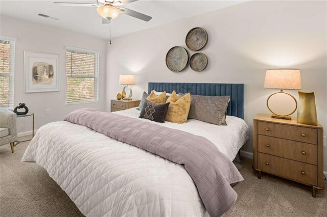 1346 Riverstone Rd Unit 107, Jonesboro, GA 30238 - bedroom featuring carpet, visible vents, baseboards, and ceiling fan