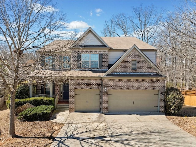 view of front of house with concrete driveway and brick siding