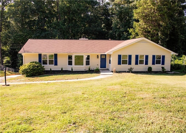 ranch-style house with a front lawn