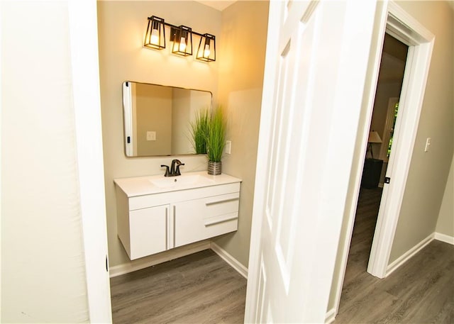 bathroom featuring vanity and wood-type flooring