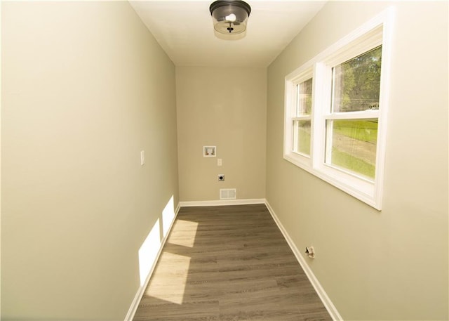 laundry area featuring hookup for a washing machine, hardwood / wood-style flooring, and hookup for an electric dryer