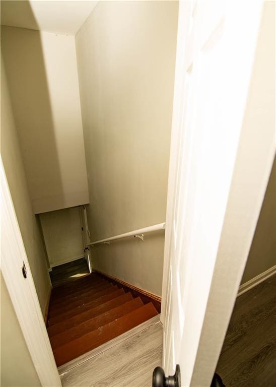 stairs with hardwood / wood-style floors