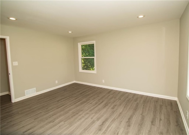 spare room featuring hardwood / wood-style flooring