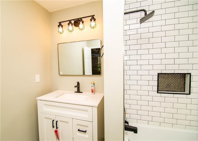 bathroom with vanity and tiled shower / bath combo