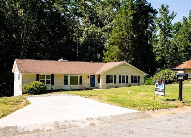 ranch-style home with a front yard