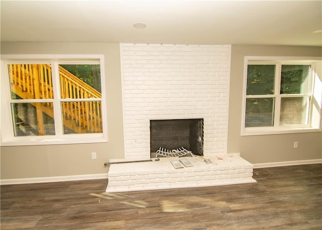 interior details featuring a fireplace and hardwood / wood-style floors