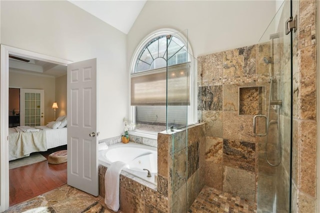 bathroom featuring a shower stall, a garden tub, ensuite bathroom, and vaulted ceiling