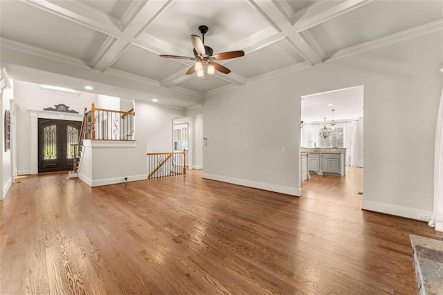 2539 Sagebrush Trl, Buford, GA 30519 - unfurnished living room featuring ceiling fan, coffered ceiling, beam ceiling, wood finished floors, and crown molding