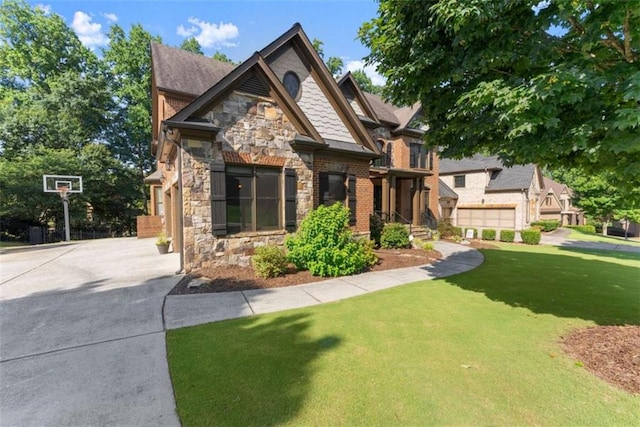 2539 Sagebrush Trl, Buford, GA 30519 - craftsman house featuring stone siding and a front lawn