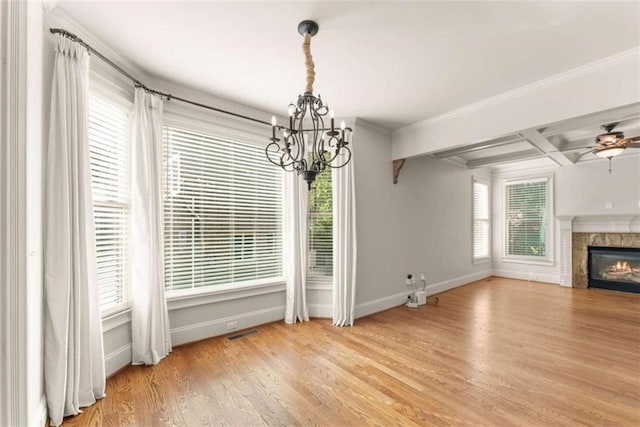 2539 Sagebrush Trl, Buford, GA 30519 - unfurnished dining area featuring a chandelier, wood finished floors, a glass covered fireplace, coffered ceiling, and ceiling fan