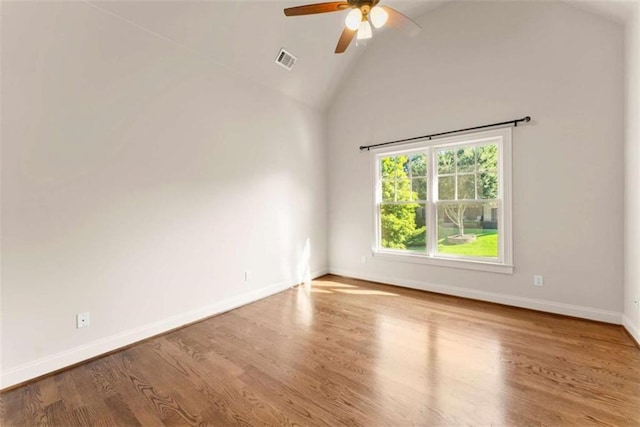 2539 Sagebrush Trl, Buford, GA 30519 - spare room with ceiling fan, wood finished floors, and high vaulted ceiling