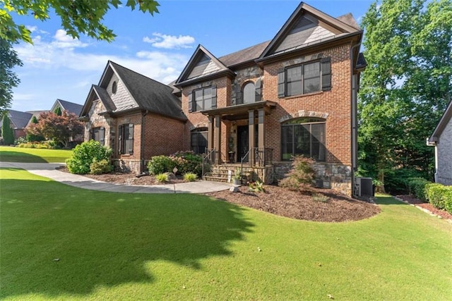 2539 Sagebrush Trl, Buford, GA 30519 - view of front of property with a front lawn, brick siding, and a porch