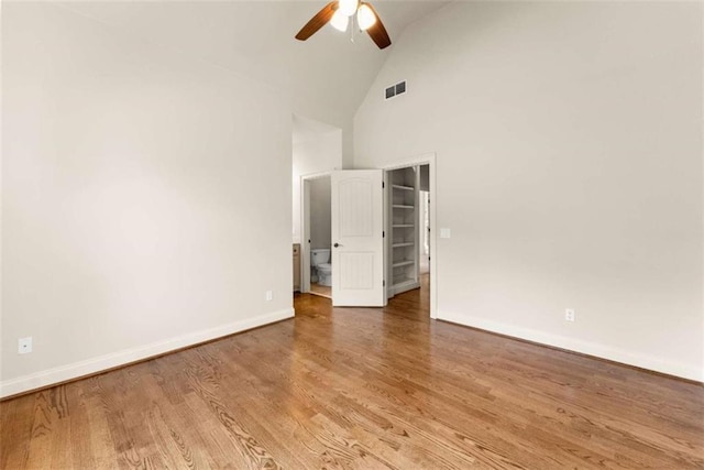 2539 Sagebrush Trl, Buford, GA 30519 - unfurnished room with a ceiling fan, wood finished floors, and high vaulted ceiling