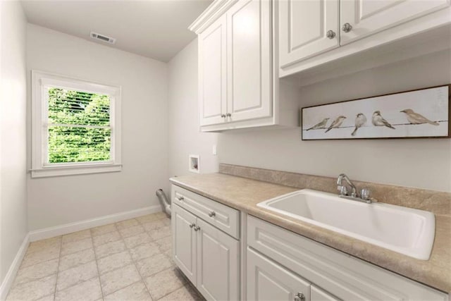 2539 Sagebrush Trl, Buford, GA 30519 - laundry room with cabinet space, washer hookup, and light flooring