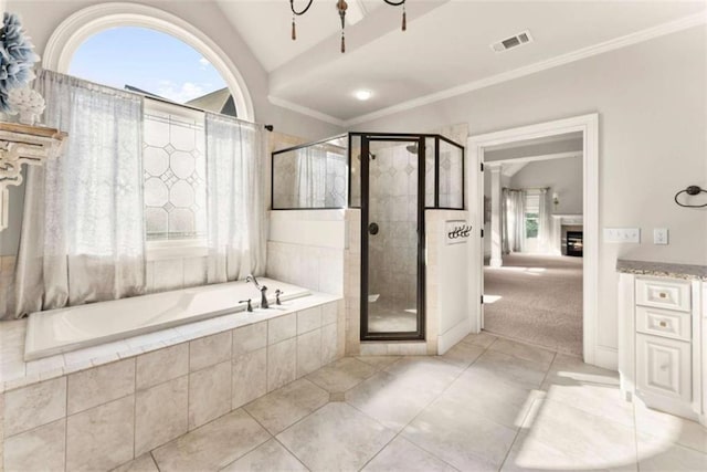 2539 Sagebrush Trl, Buford, GA 30519 - full bath with a garden tub, a shower stall, lofted ceiling, vanity, and tile patterned floors