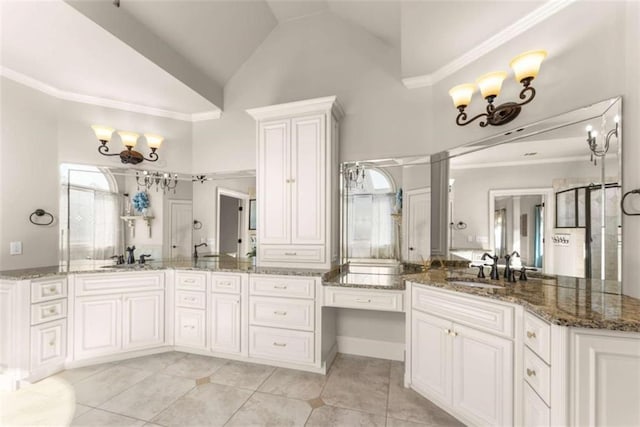2539 Sagebrush Trl, Buford, GA 30519 - full bath featuring a chandelier, tile patterned floors, vaulted ceiling, vanity, and crown molding