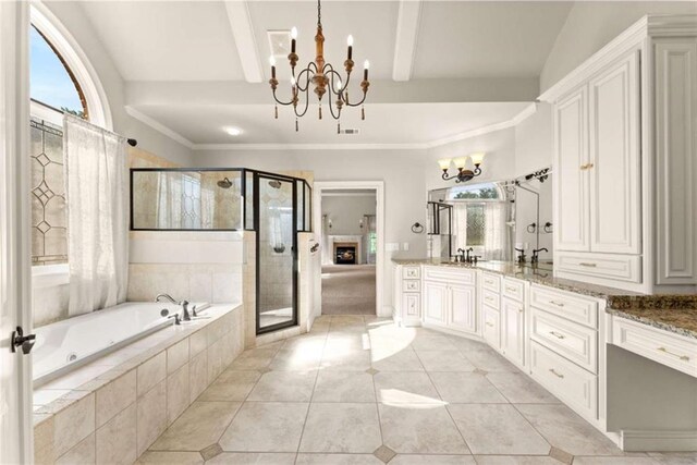 2539 Sagebrush Trl, Buford, GA 30519 - bathroom with a chandelier, a bath, vanity, and a stall shower