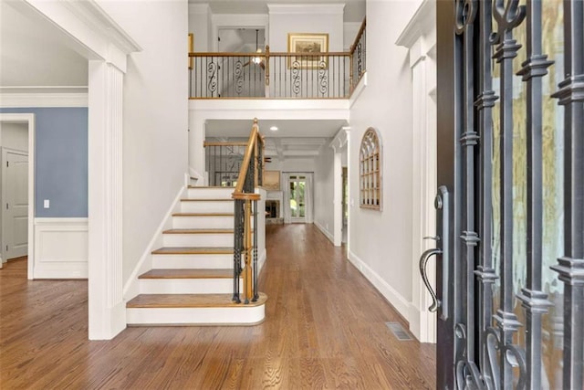 2539 Sagebrush Trl, Buford, GA 30519 - foyer entrance with stairway, wood finished floors, ornamental molding, and a towering ceiling