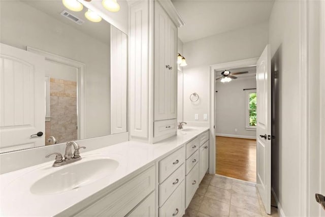 2539 Sagebrush Trl, Buford, GA 30519 - bathroom with double vanity, a ceiling fan, and tile patterned flooring