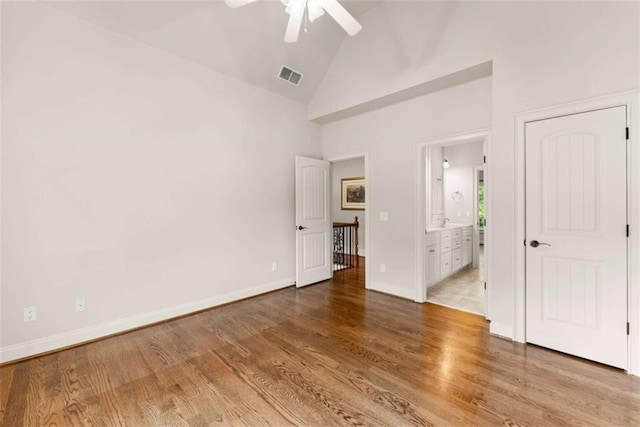 2539 Sagebrush Trl, Buford, GA 30519 - unfurnished bedroom featuring high vaulted ceiling, wood finished floors, ensuite bathroom, and ceiling fan
