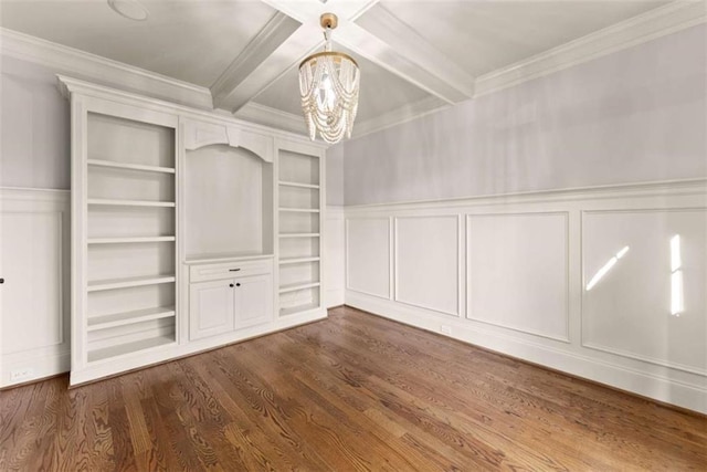 2539 Sagebrush Trl, Buford, GA 30519 - unfurnished dining area with a chandelier, beamed ceiling, a decorative wall, ornamental molding, and dark wood-style flooring