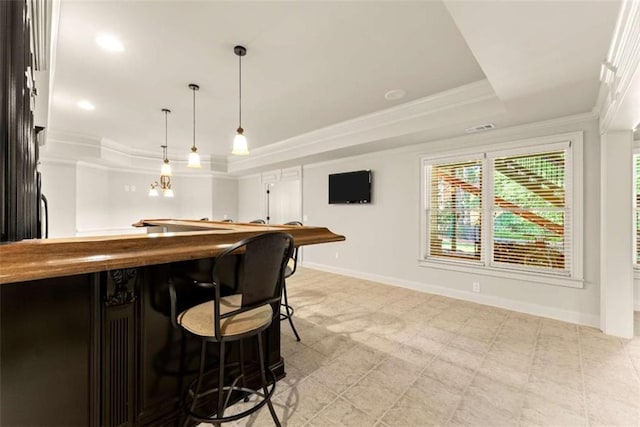 2539 Sagebrush Trl, Buford, GA 30519 - bar featuring a raised ceiling, crown molding, and decorative light fixtures