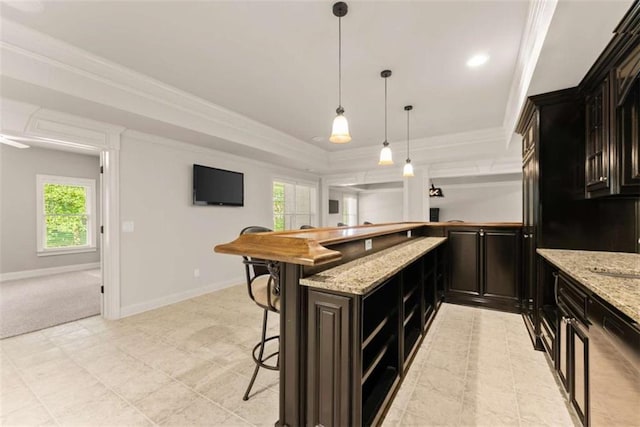 2539 Sagebrush Trl, Buford, GA 30519 - kitchen featuring a raised ceiling, a breakfast bar area, plenty of natural light, crown molding, and light stone counters