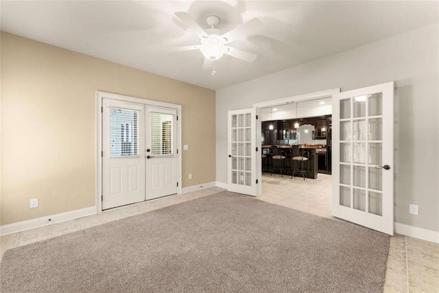 2539 Sagebrush Trl, Buford, GA 30519 - unfurnished room with french doors, ceiling fan, light tile patterned flooring, and light carpet