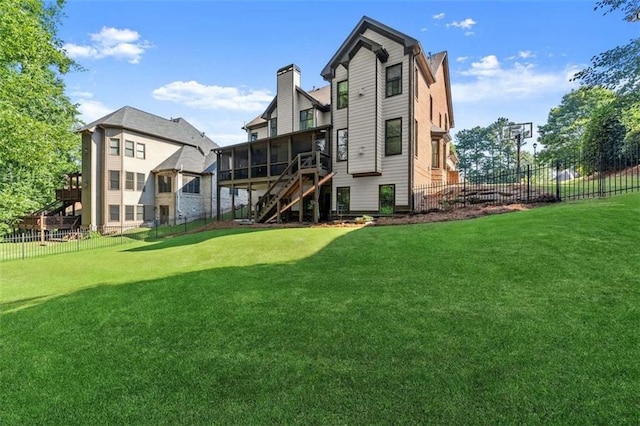 2539 Sagebrush Trl, Buford, GA 30519 - rear view of house featuring a sunroom, stairs, and a chimney