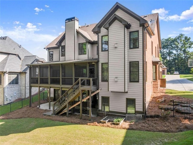 2539 Sagebrush Trl, Buford, GA 30519 - back of house featuring a sunroom, stairway, and a chimney