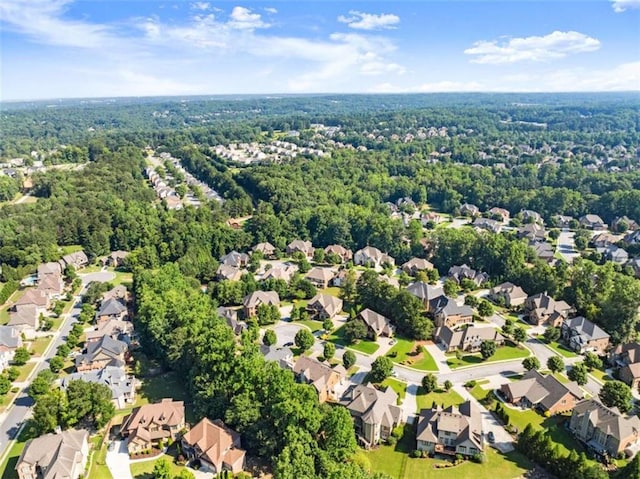 2539 Sagebrush Trl, Buford, GA 30519 - aerial view of property and surrounding area featuring nearby suburban area and a heavily wooded area