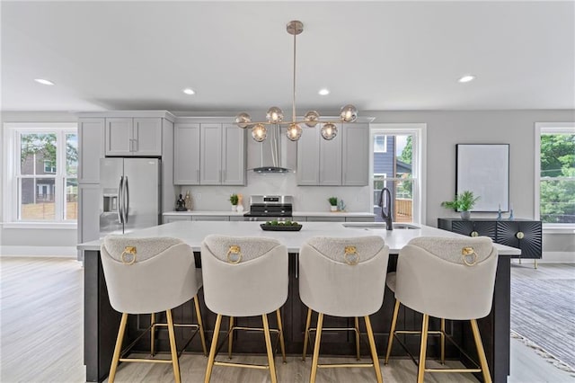 101 Fairfield Ct, Atlanta, GA 30314 - kitchen with a sink, stainless steel appliances, light countertops, gray cabinets, and an island with sink