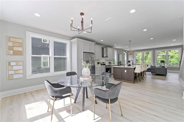 101 Fairfield Ct, Atlanta, GA 30314 - dining area featuring a chandelier, recessed lighting, light wood-style flooring, and baseboards