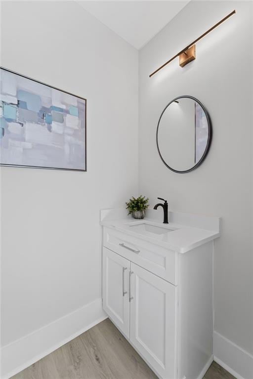 101 Fairfield Ct, Atlanta, GA 30314 - bathroom featuring baseboards, wood finished floors, and vanity