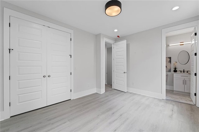 101 Fairfield Ct, Atlanta, GA 30314 - unfurnished bedroom with light wood-style floors, baseboards, recessed lighting, a closet, and connected bathroom