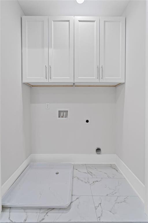 101 Fairfield Ct, Atlanta, GA 30314 - clothes washing area featuring electric dryer hookup, marble finish flooring, hookup for a washing machine, cabinet space, and baseboards
