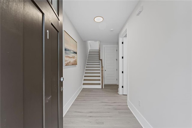 101 Fairfield Ct, Atlanta, GA 30314 - hall with baseboards, stairs, and light wood-style flooring