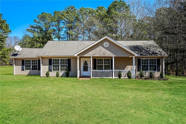 ranch-style home with a front lawn and covered porch