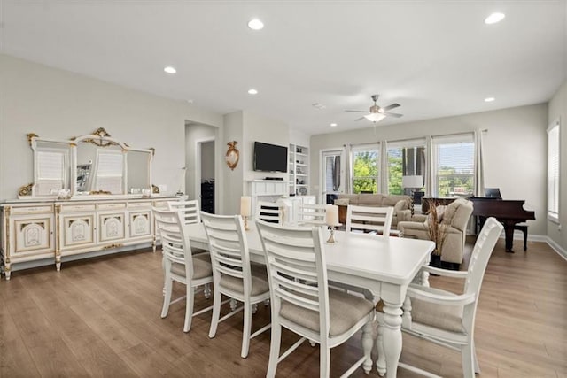 dining room featuring ceiling fan and light wood-type flooring