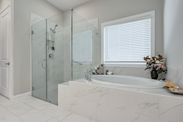 bathroom featuring independent shower and bath