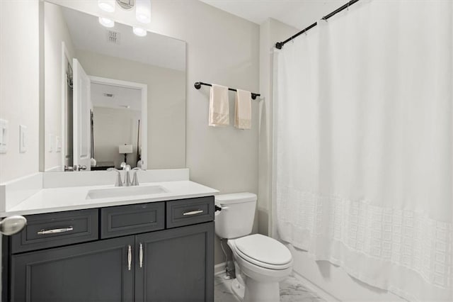 full bathroom featuring shower / tub combo, vanity, and toilet