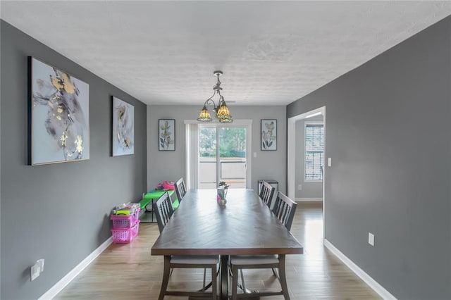 147 Midland Dr, Stockbridge, GA 30281 - dining area featuring baseboards, wood finished floors, and a textured ceiling